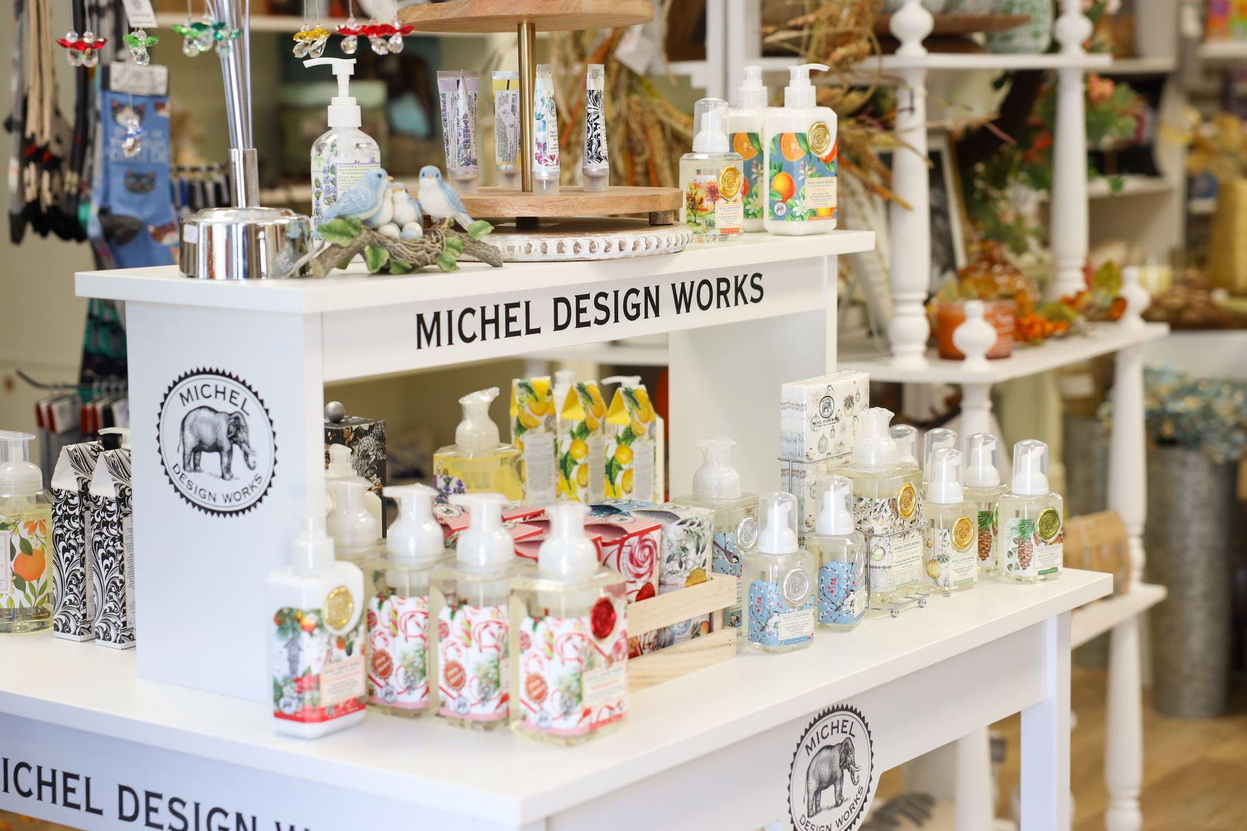 A Michel Design Works display of floral foaming soaps, lotions, and hand creams