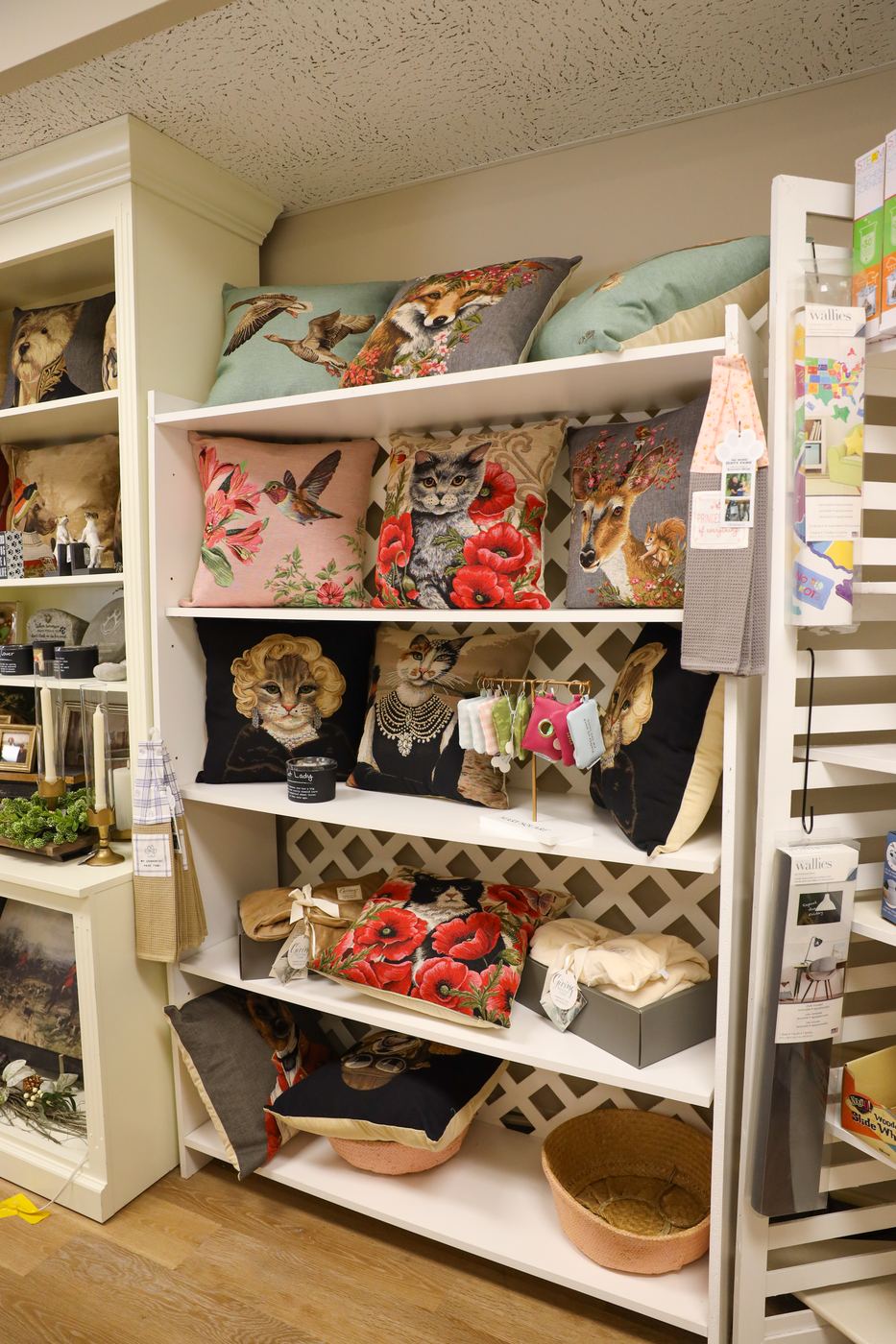 The shop's pillow wall of animal and floral tapestry designs