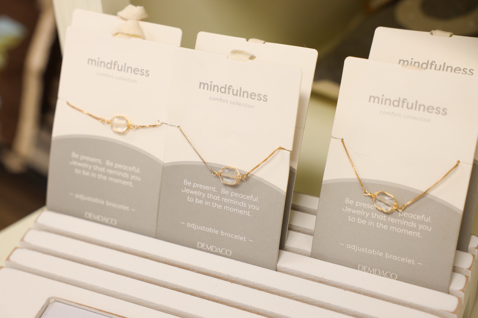 Delicate necklaces on message cards at The Finishing Touch Store