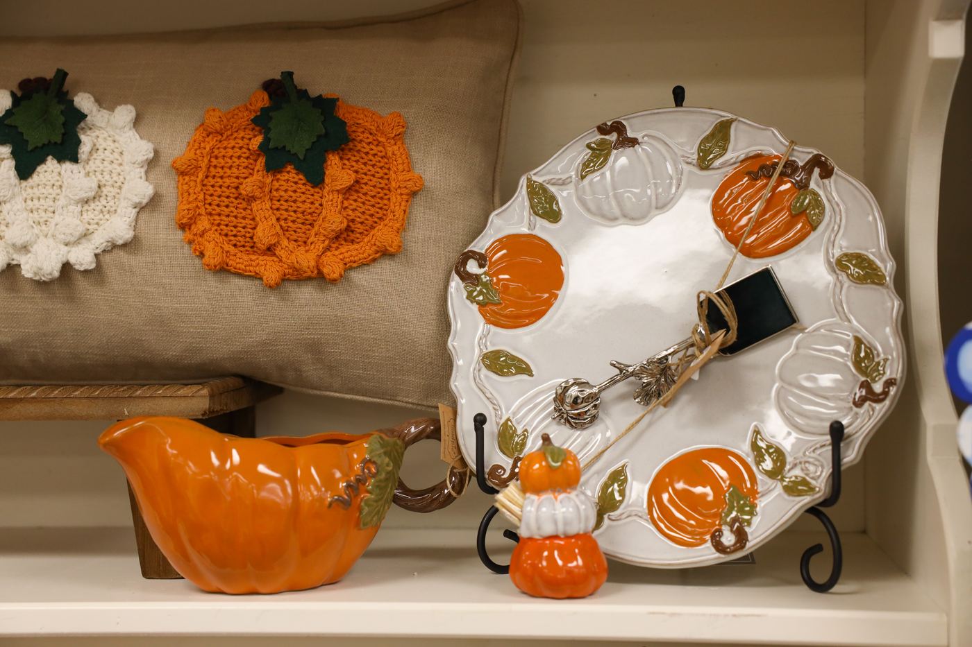 Pumpkin tableware and a pumpkin-shaped gravy boat on display