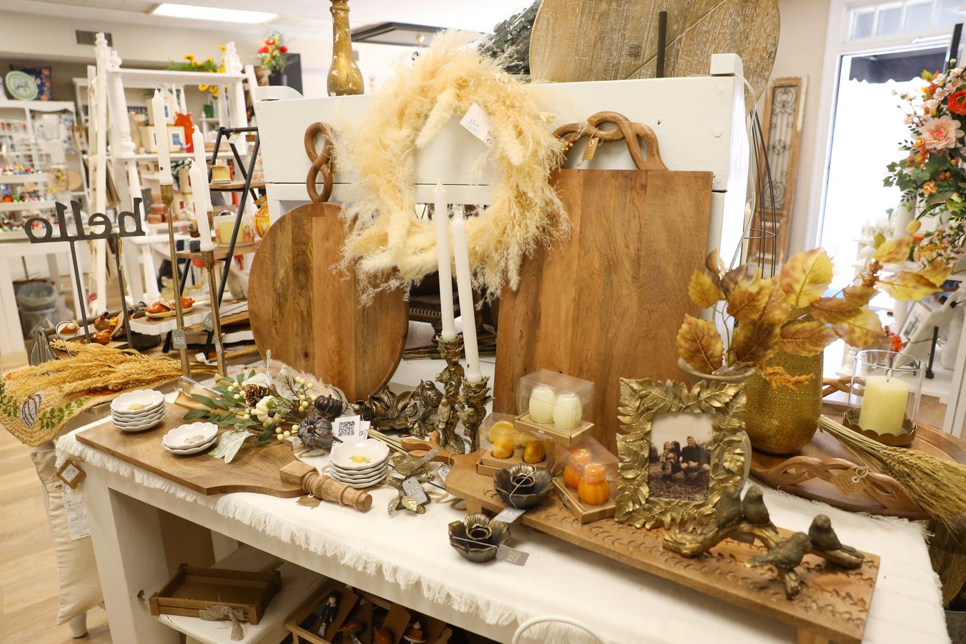 Wooden cutting boards beneath a pampas grass wreath